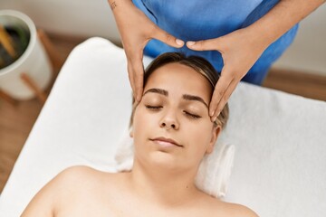 Woman couple having facial massage at beauty center