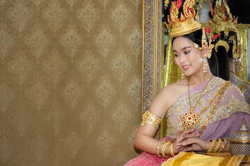 Beautiful woman in traditional dress Thai costume, Asian woman wearing typical Thai dress identity culture of Thailand