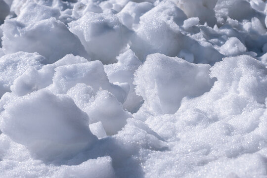 The texture of the snow under the rays of the sun. Snow torros. Ice.