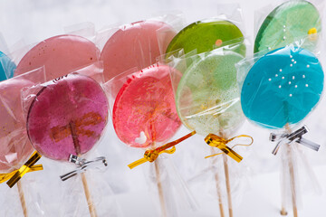 Set of colorful and sweet lollipops on a white table
