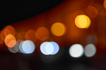 Texture blur, blurred highlights lights. Evening and night light on city streets.