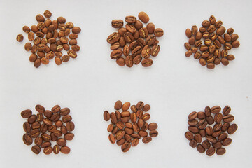 different types of coffee are piled in heaps