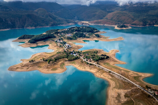 Aerial view of Rama Lake with a few buildings along the coast, Bosnia and Herzegovina.