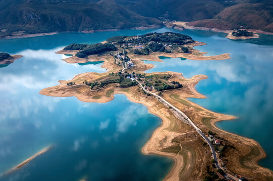 Aerial view of Rama Lake with a few buildings along the coast, Bosnia and Herzegovina.