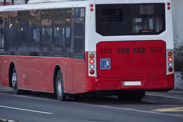 Obraz na płótnie Canvas Public transportation bus in urban surroundings.