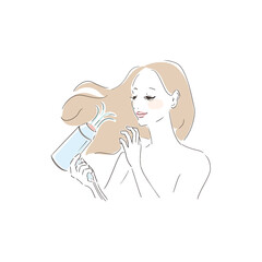 ヘアドライヤーで髪を乾かす美しい女性