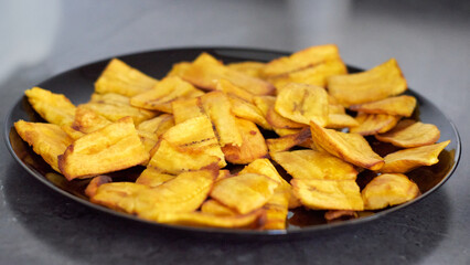 fried banana slices in a plate tajadas