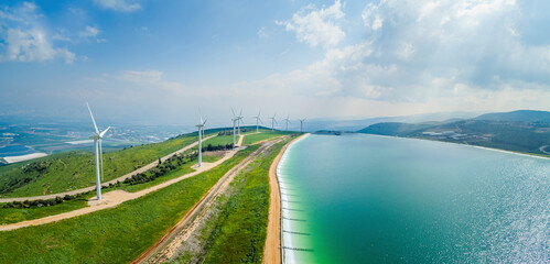Panoramic aerial view of wind turbine and artificial lake, Mount Gilboa, Israel.