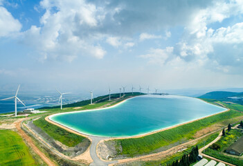 Aerial view of wind turbine and artificial lake, Mount Gilboa, Israel.