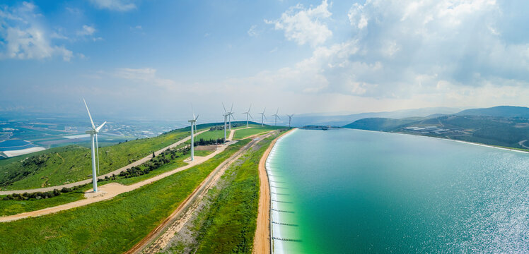Panoramic aerial view of wind turbine and artificial lake, Mount Gilboa, Israel.