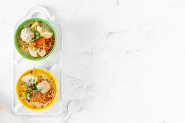 Spring bright soup with meatballs and vegetables. Copy space.