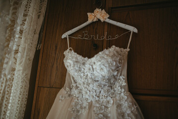 Beautiful wedding dresses on a hanger.