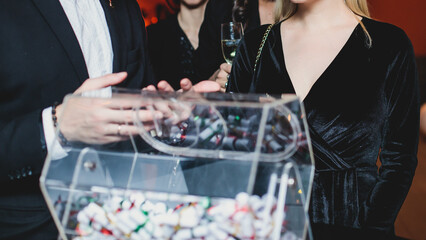Process of prize drawings, extracting a winning numbers of lottery machine, raffle drum with bingo...