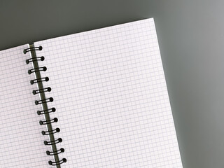 An open notebook in a checkered close-up