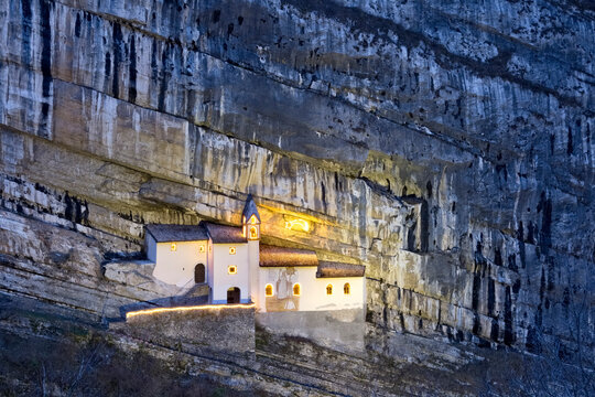 The hermitage of San Colombano was built in the Middle Ages in a niche of the rocky wall. Trambileno, Trento province, Trentino Alto-Adige, Italy, Europe.