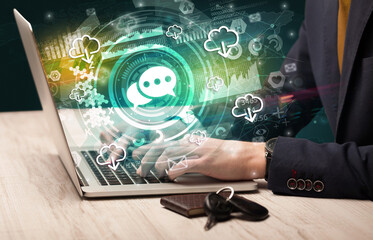 Business hand typing on a modern laptop