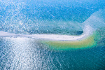 Meeting of two seas, Kinburn Spit, Ukraine, amazing aerial view. The border of the blue Black Sea and the Dnieper river, wild nature, beautiful landscape in bright sunny weather.