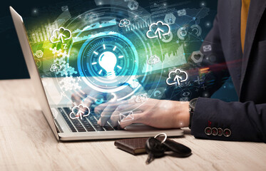 Business hand typing on a modern laptop