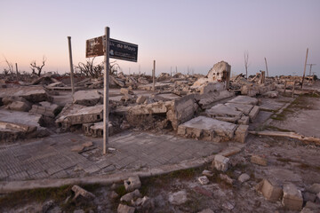 Old destroyed building ruins at sunset