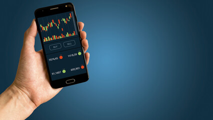 Person holding smartphone with technical indicator tools. Trading concept.