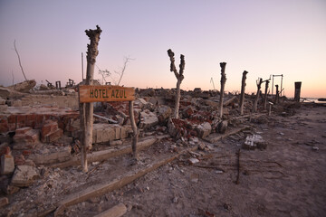 Old destroyed building ruins at sunset