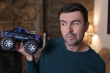 Man holding cool monster truck model