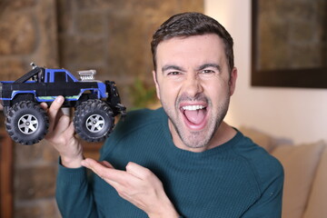 Man holding cool monster truck model © ajr_images
