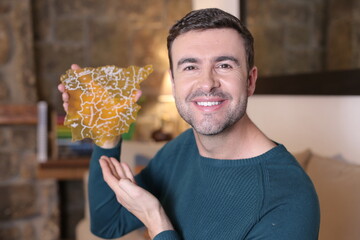 Man holding Spanish country geographic shape