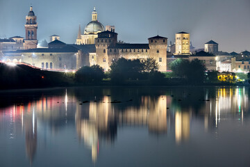 Naklejka na ściany i meble Mantova: the San Giorgio castle is reflected on the middle lake of the Mincio river. The city has been included in the list of UNESCO World Heritage Sites. Lombardy, Italy, Europe.