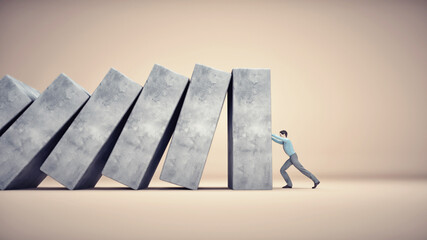 Man holds falling concrete cubes.