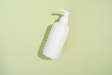 Blank white Bottles for Cosmetics, Mock up Cream Jar on a Olive Green background, Packaging for Cosmetics without logo and label