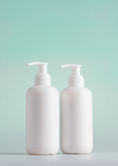 Blank white Bottles for Shampoo, Mock up packaging on a blue light background, Packaging for Shampoo without logo and label