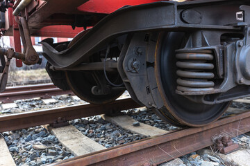 Close up of train car undercarriage, passenger train, freight train, a train brakes