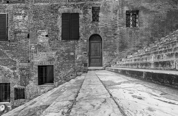 Classic Door, Window, Wall and Staircase in historical city Siena, Tuscany, Italy