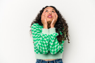 Young hispanic woman isolated on white background whining and crying disconsolately.