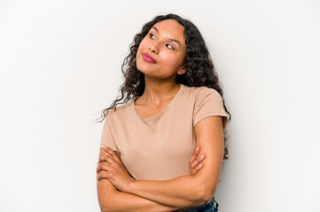Young hispanic woman isolated on white background dreaming of achieving goals and purposes