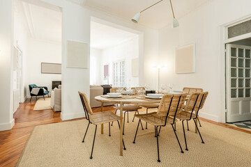 Dining room in a vacation rental with wicker chairs and wooden dining table