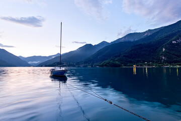 Naklejka na ściany i meble Boat moored on Lake Ledro. Ledro valley, Trento province, Trentino Alto-Adige, Italy, Europe. 