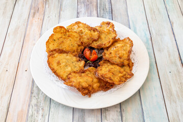 Shrimp totita originating in the province of Cádiz, Andalusia, is an omelette made with wheat flour, chickpea flour, water, salt, spring onion, parsley and shrimp.