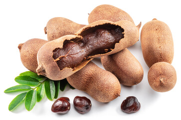Ripe tamarind fruit, leaves and some tamarind seeds isolated on white background.