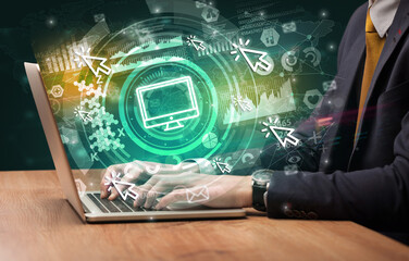 Business hand typing on a modern laptop