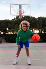 latin woman playing on the basketball court