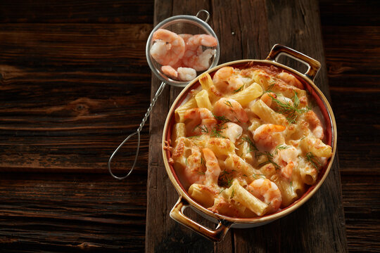 View Of The Saucepan With Appetizing Creamy Rigatoni Pasta With Shrimps And Herbs