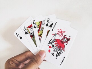 Playing cards held in hand