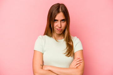 Obraz premium Young caucasian woman isolated on pink background unhappy looking in camera with sarcastic expression.