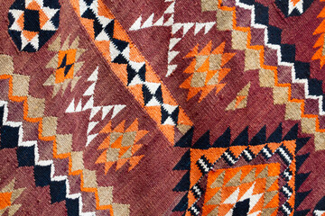 Close-up shot of carpet decorated with traditional Turkish patterns