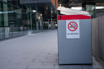 no smoking sign on garbage bin 