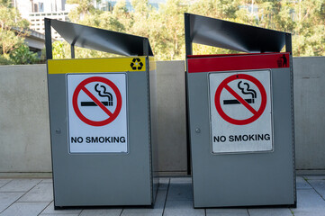 no smoking signs and bins 