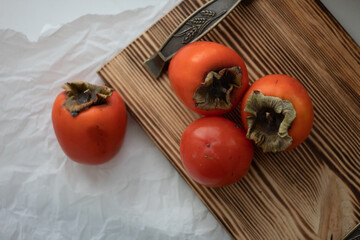 persimmon on a cutting board