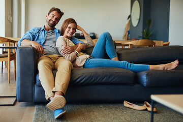 Chilling out with my number one. Full length portrait of an affectionate young couple relaxing on...